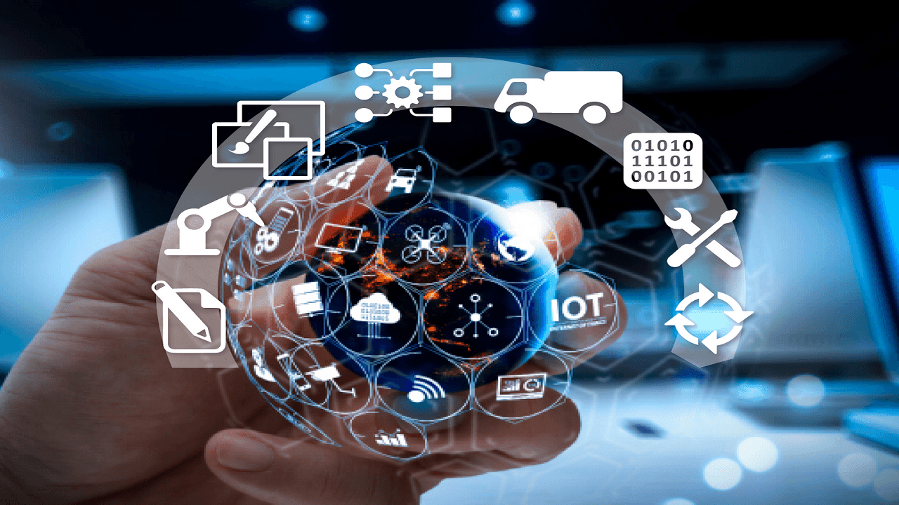 Hand holding digital globe displaying IoT icons, with technology and network symbols surrounding it.